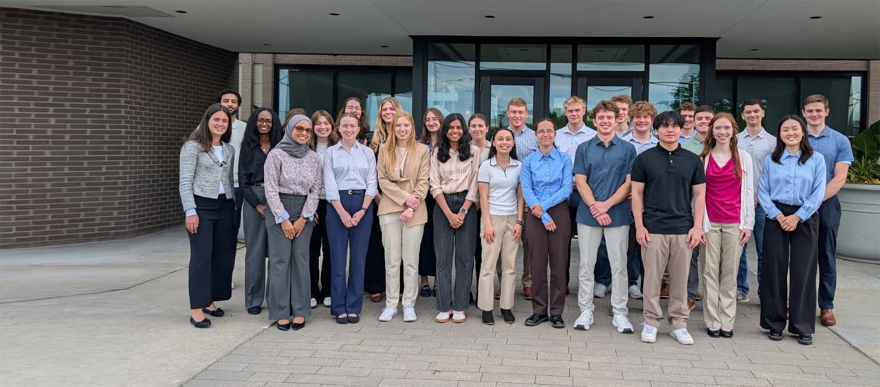 Group of interns in front of Donaldson headquarters. 