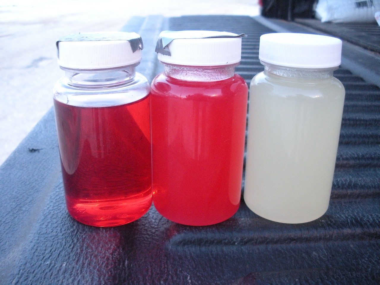 Upper Midwest (United States) diesel fuels stored at -23° C / -9° F (left to right): #1 off-road, #2 off-road, and #2 on-road. Both #2 samples have been treated with cold flow additive and still show significant filterable paraffin-wax solid formation. See Strategy 1.