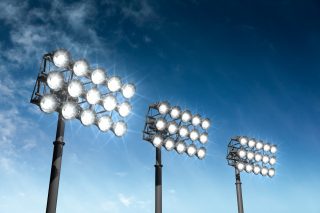 iStock_000014577184_XXXLarge; three sets of stadium lighting at dusk