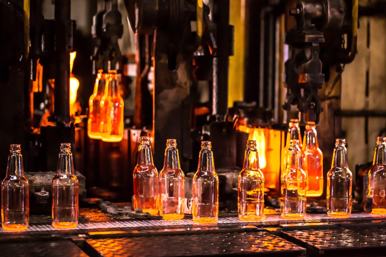 Clear glass bottles during the manufacturing process