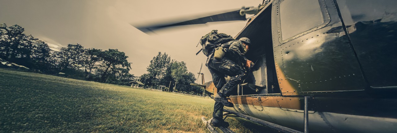 Soilder entering helicopter banner